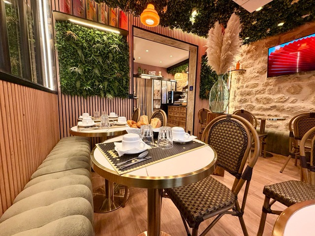 A set table and the green banquette in the breakfast room