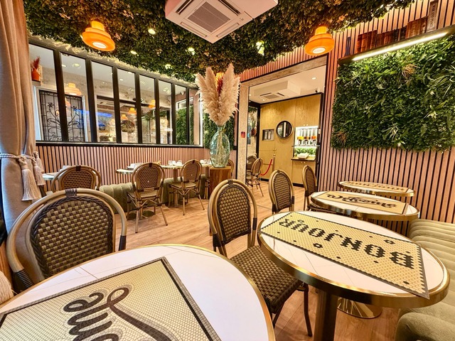 Bistro tables in the breakfast room with their mosaic tops